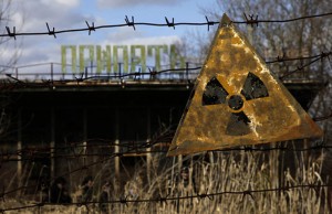 A radioactive sign hangs on barbed wire outside a café in Pripyat.